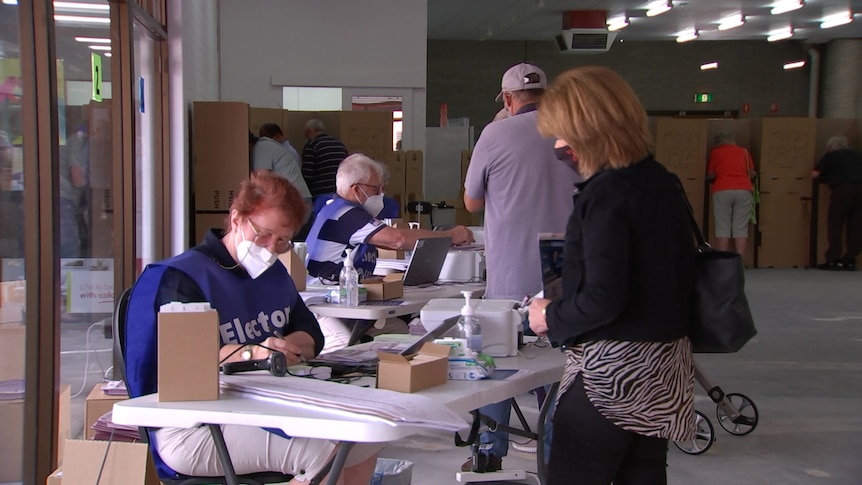 Pre-poll ballots are distributed in suburban Adelaide.