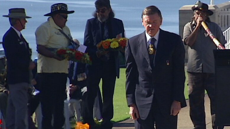 Governor Malcolm McCusker lays a wreath
