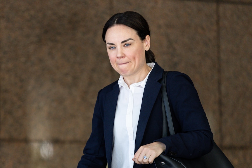 Detective Senior Constable Abbey Justin walks out of the Melbourne Magistrates' Court.