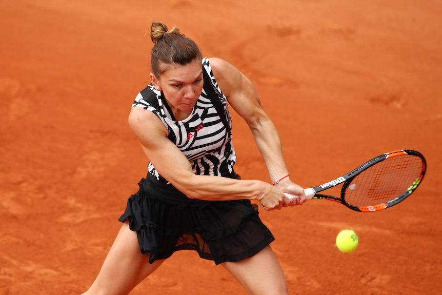 Simona Halep hits a backhand at Roland Garros