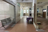 Dilapidated hospital hallway with no equipment or facilities 