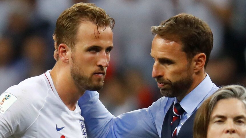 Manager Gareth Southgate consoles Harry Kane after England's World Cup exit