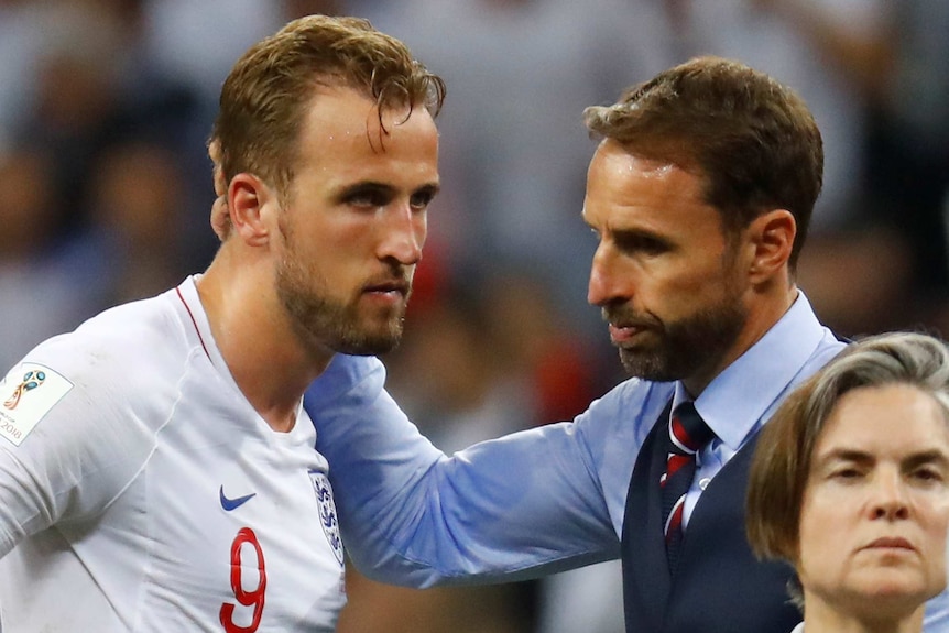Manager Gareth Southgate consoles Harry Kane after England's World Cup exit