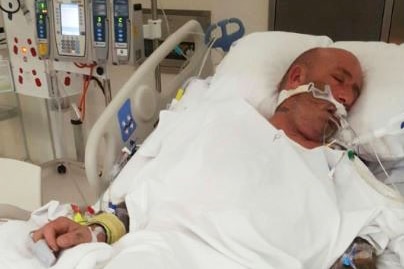 The 59-year-old Ararat man lies in a coma in a hospital bed.