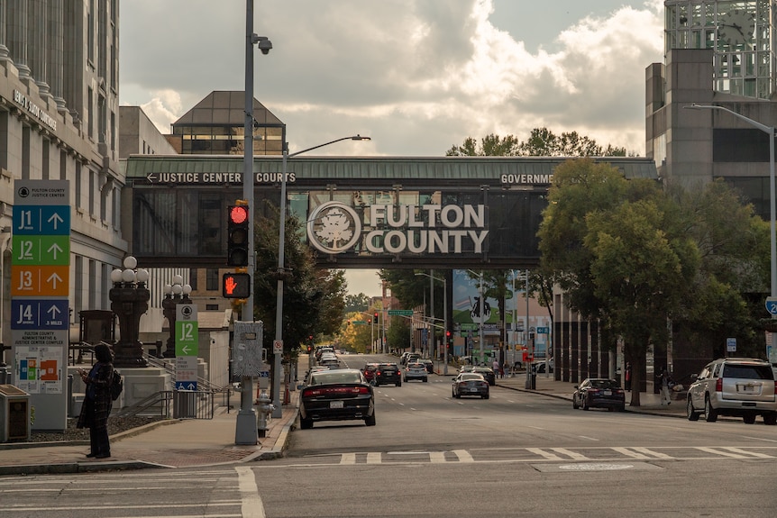 A sign reads Fulton County on a bridge over street in Atlanta, Georgia 