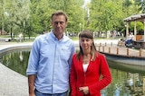 Ksenia Fadeyeva posting for a picture next to Alexei Navalny