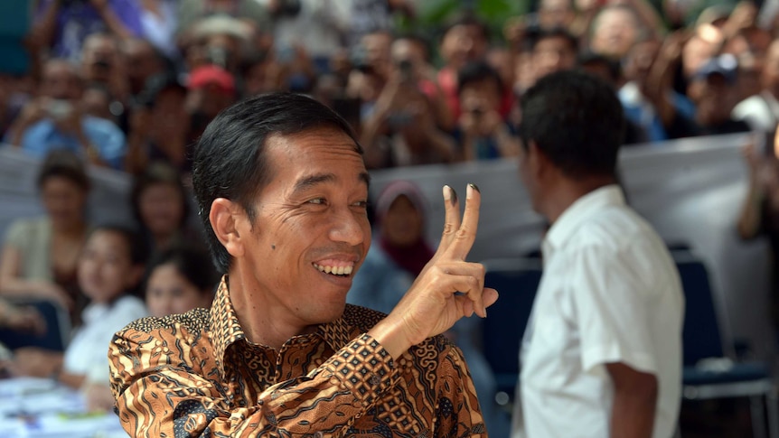 Indonesian presidential candidate Joko Widodo smiling after casting his vote