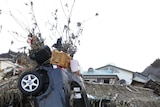 Debris strewn about a devastated village in Rikuzentakata, north-east Japan.