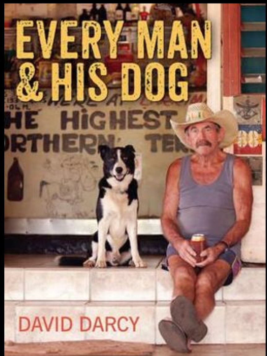 A book cover image shows a man in a blue singlet holding a tin of beer while sitting with his dog.