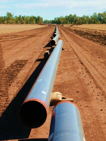 Pipes laid out during the construction phase of a pipeline.