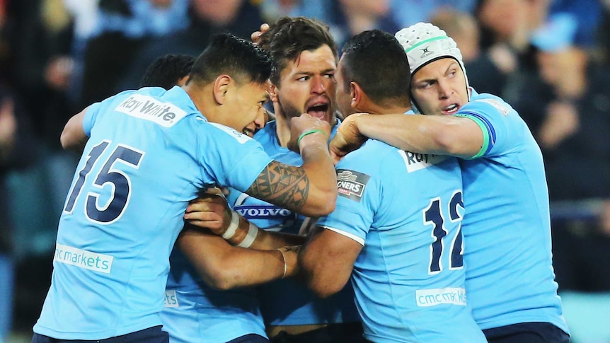 Team effort ... Adam Ashley-Cooper celebrates a try with his team-mates