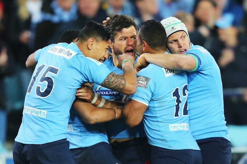 Team effort ... Adam Ashley-Cooper celebrates a try with his team-mates