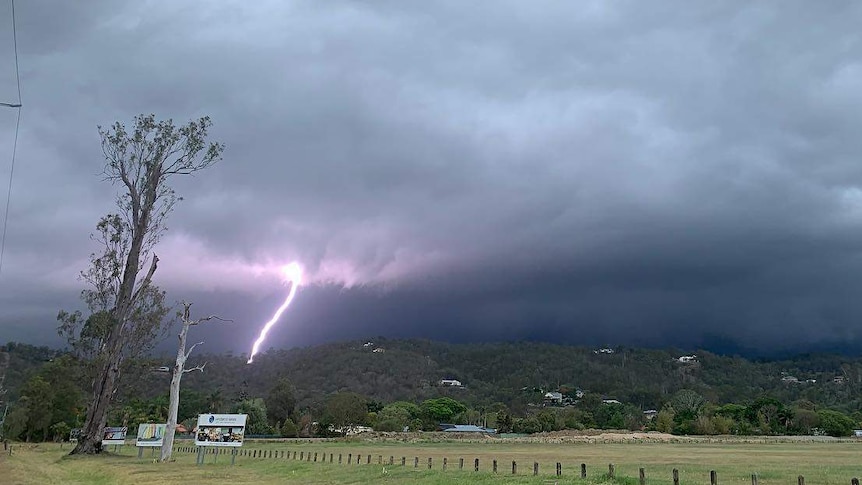 A lightning strike is seen in the distance near Windaroo south of Brisbane.
