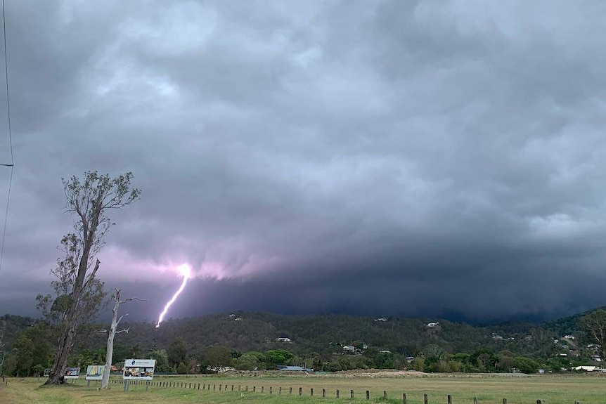 A lightning strike is seen in the distance near Windaroo south of Brisbane.