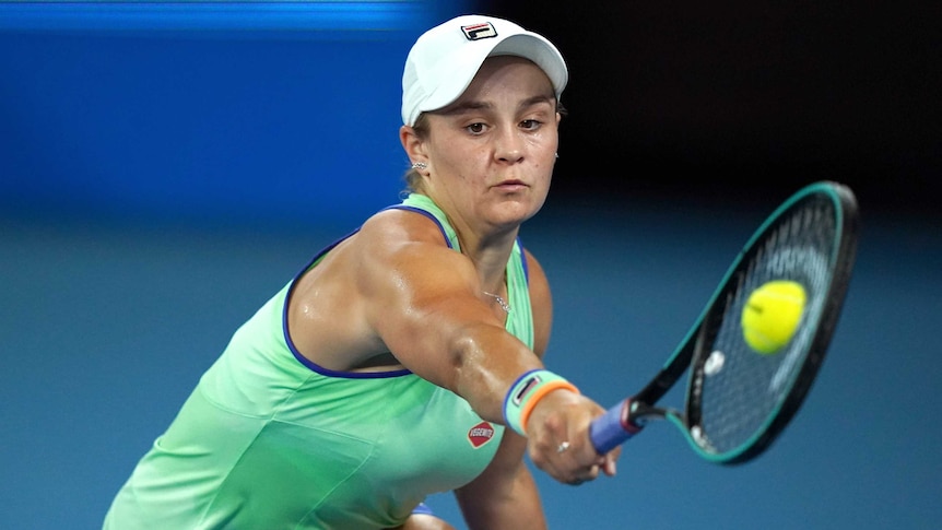 A tennis ball hits the racket of Ash Barty during her first Australian Open match.