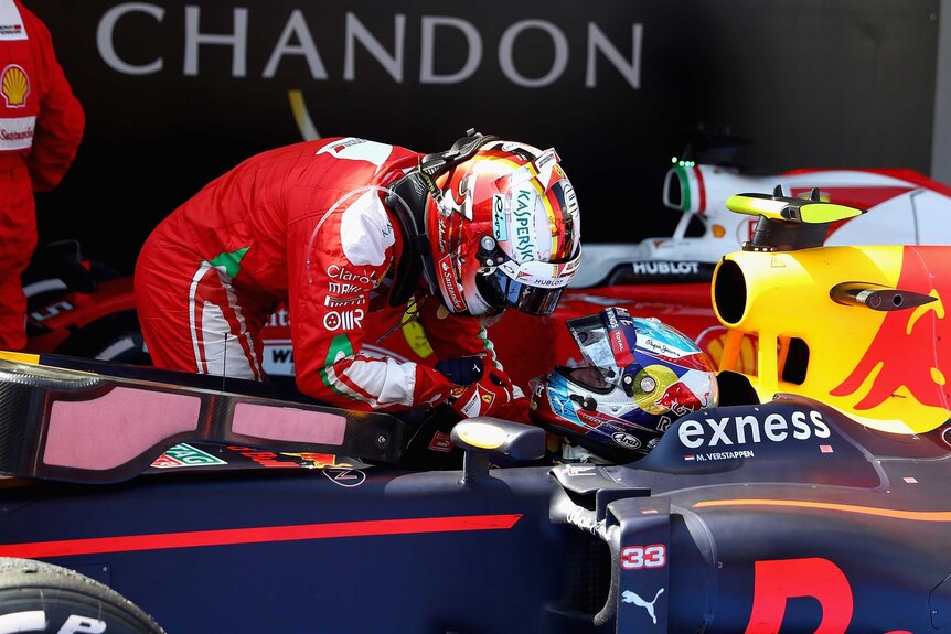 Sebastian Vettel congratulates Max Verstappen