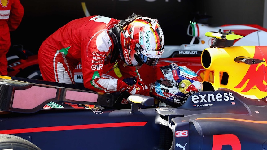Sebastian Vettel congratulates Max Verstappen