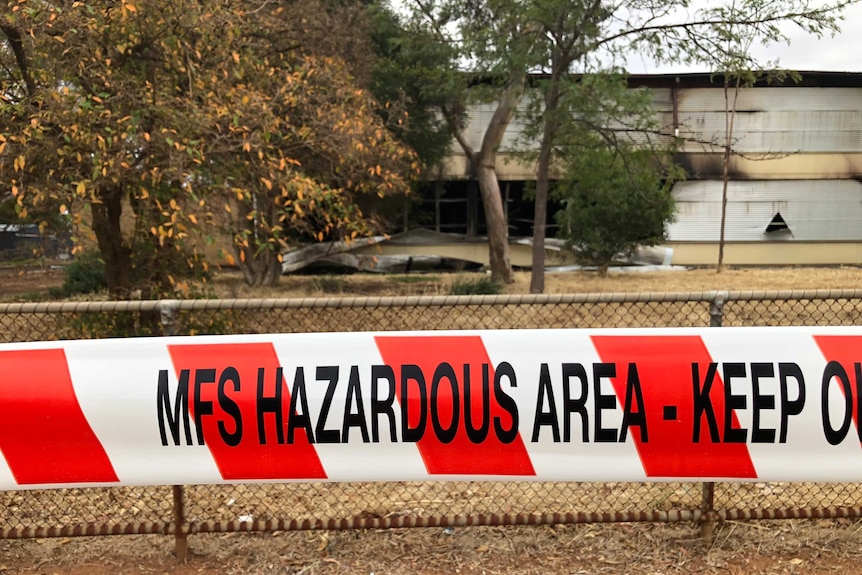 MFS tape around a gutted school.