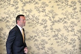 Opposition Leader Tony Abbott leaves a press conference