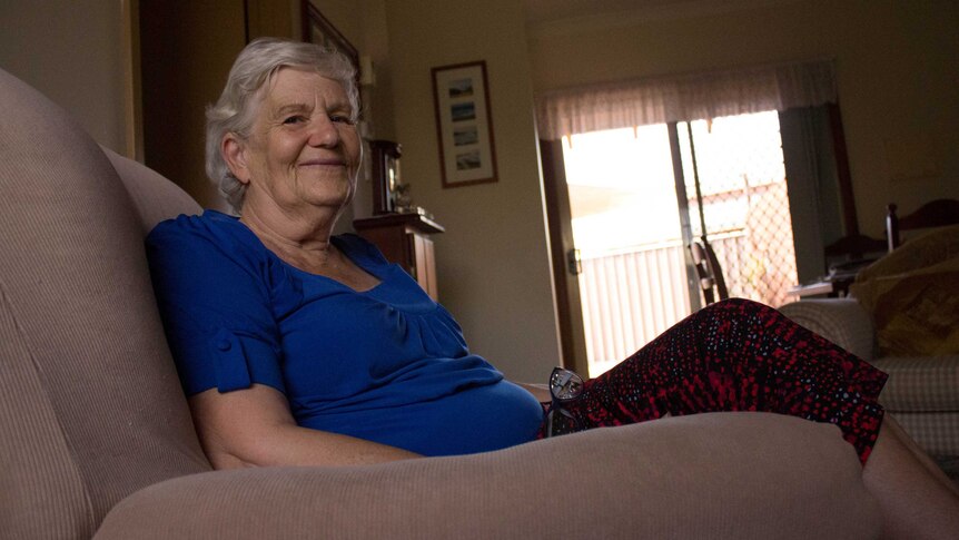 Jeanette Dyson sits in her living room at her home in the Kalgoorlie Masonic Village.