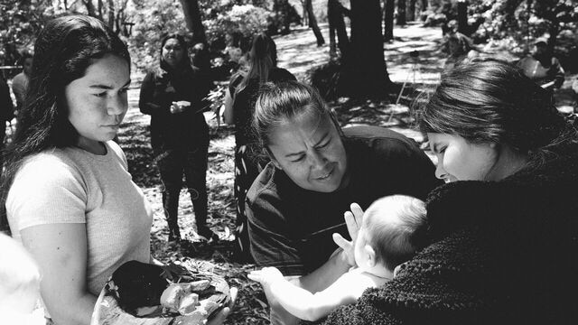 Black-and-white photo of a birthing ceremony on country