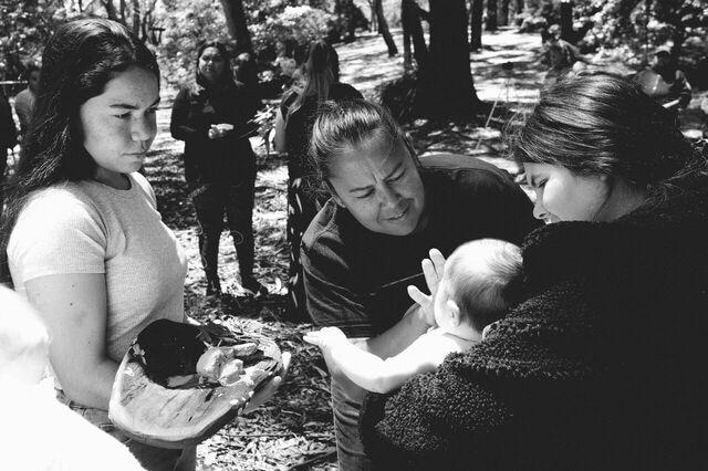 Black-and-white photo of a birthing ceremony on country