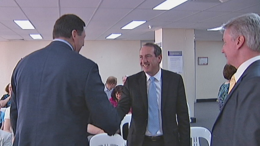 Former Labor MP Mike Kelly congratulates the new Liberal Member for Eden-Monaro Peter Hendy.