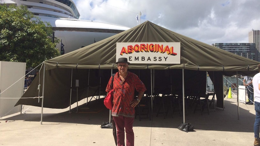 Richard Bell stands outside his exhibition, Embassy, in Circular Quay