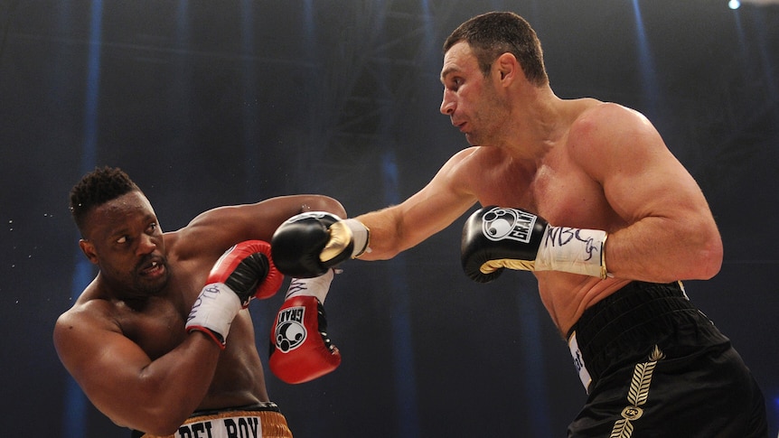Klitschko forces Chisora back with a big right hand.