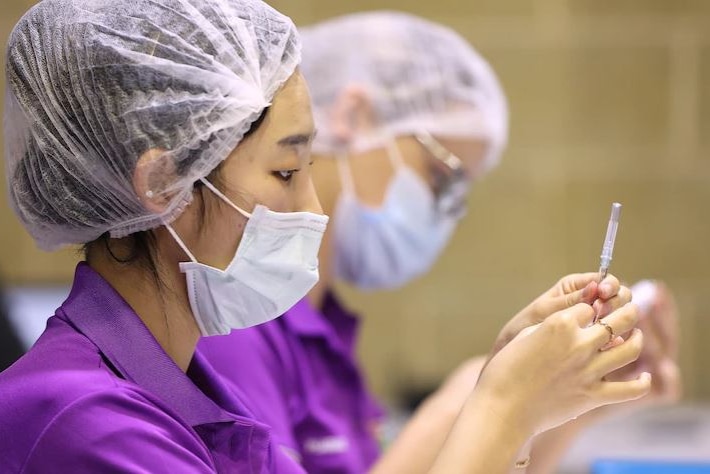 Nurse drawing up vaccine