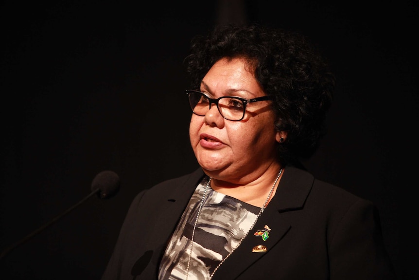 Dr June Oscar addresses the National Native Title Conference from lectern
