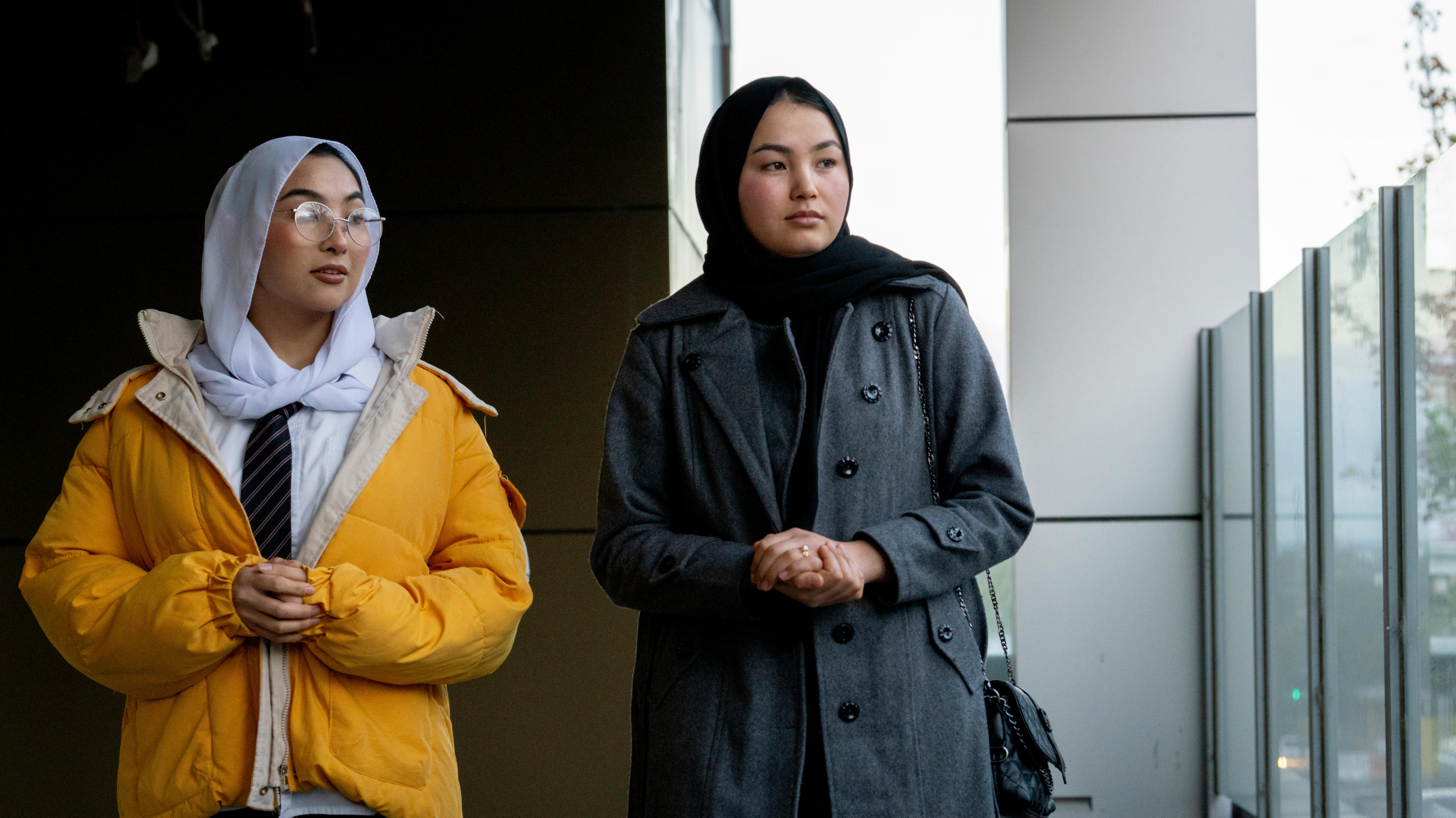 Arya and Adiba stand together, pondering towards the sky