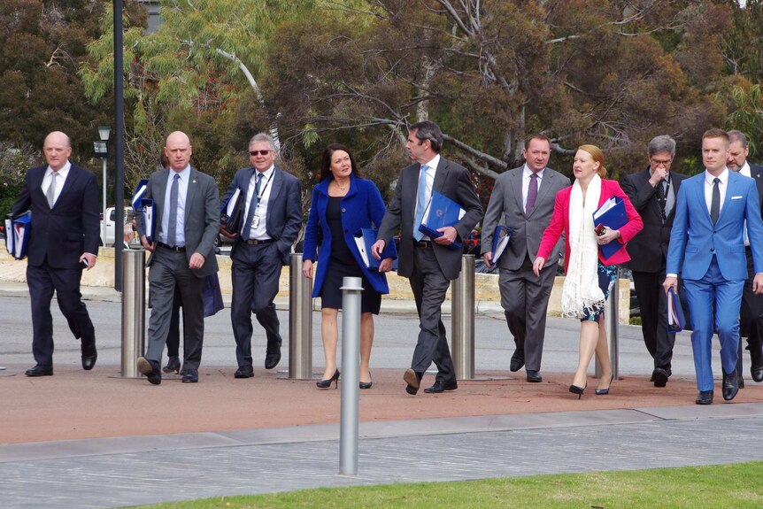 A group of at least 11 Liberal Cabinet ministers supporting Premier Colin Barnett arrives at Dumas House in Perth.