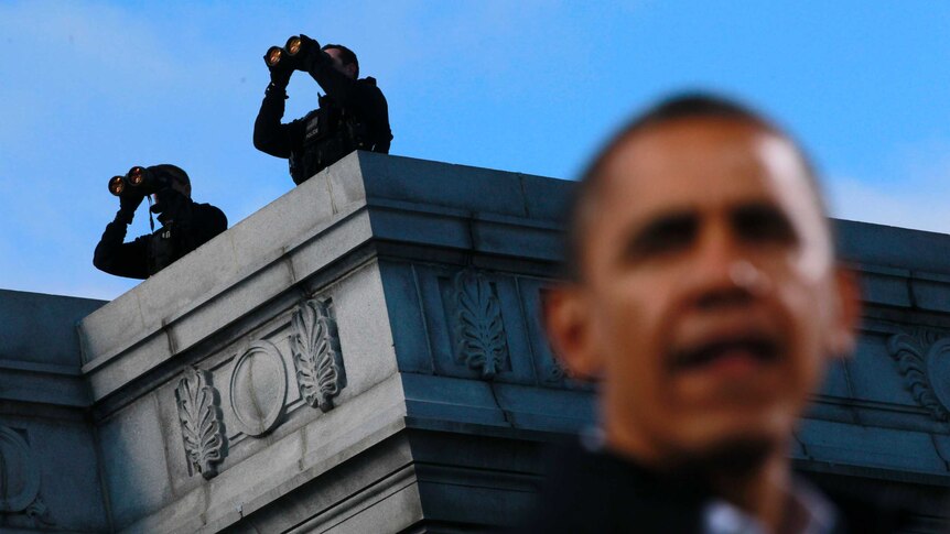 Counter assault team members watch over Barack Obama at a campaign rally in Concord, New Hampshire, November 4, 2012.