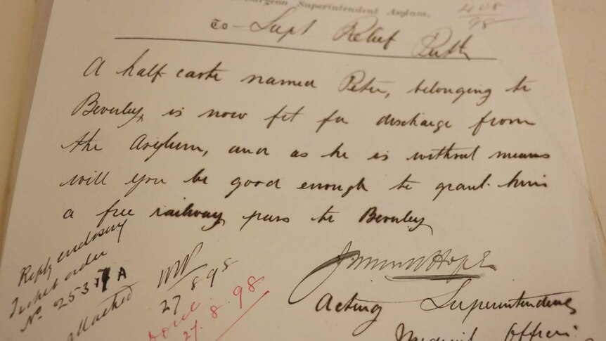 A letter sent in 1898 to WA's Chief Protector of Aborigines about an Indigenous person sits on a white table.