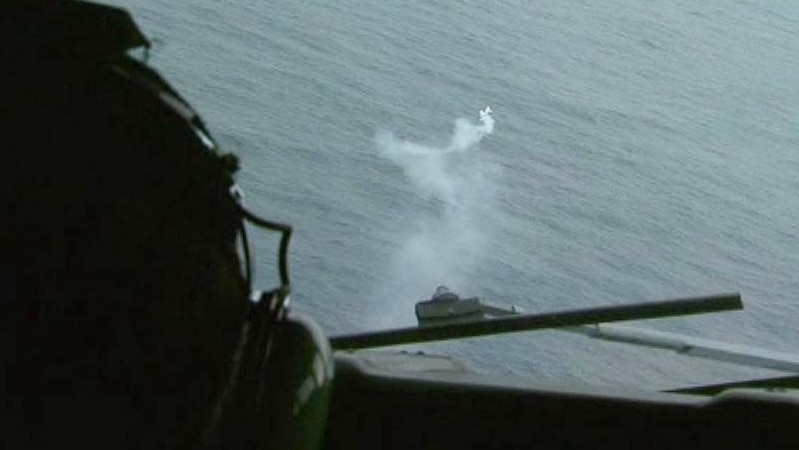 A flare marks the spot where an RAAF Orion spotted some debris in the search for MH370 in the Indian Ocean