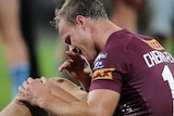 Daly Cherry-Evans holds injured knee in Origin one