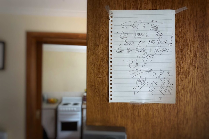 handwritten note on the door of Tony Bull's unit in Tasmania.