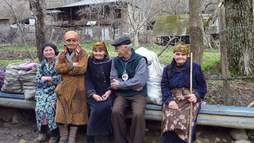 Australian nurse Andrew Cameron with local women in Georgia in Europe