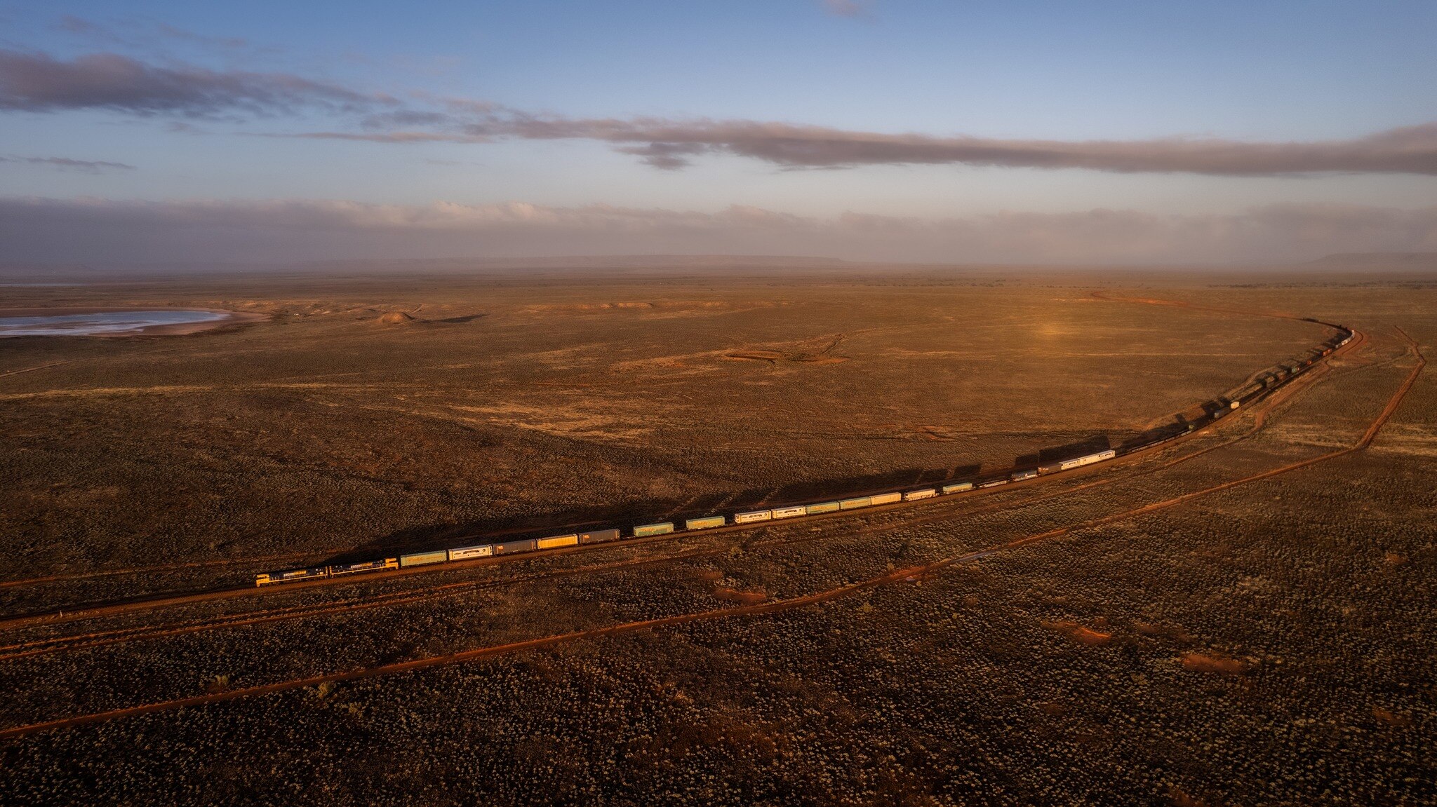 An aerial view of a freight train in a remote part of the outback.  