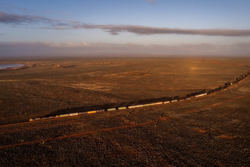 An aerial view of a freight train in a remote part of the outback.  