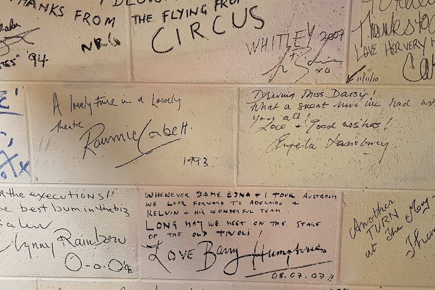 Celebrity signatures on the wall of Her Majesty's Theatre.
