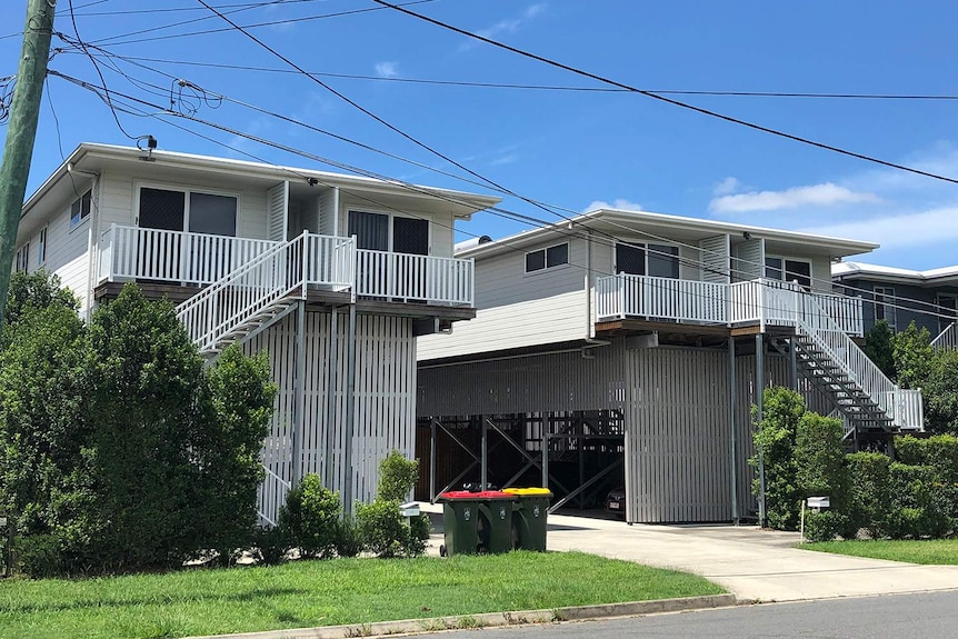 Two raised and rebuilt grey houses in Darnley Street at Rocklea after the 2011 floods.