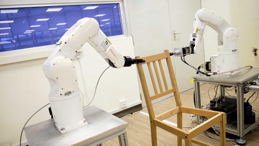 Robotic arms assembling an Ikea chair.