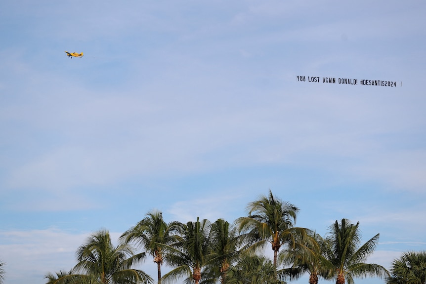 A yellow plan flies over Mar-a-Lago resort with the words: "You lost again Donald. #DeSantis2024"