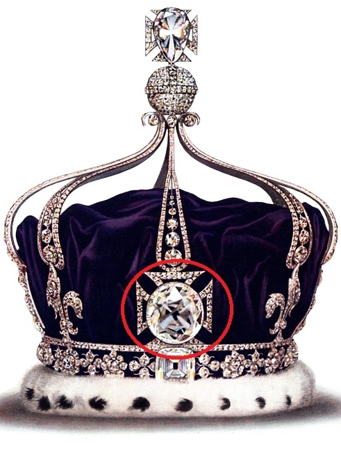 A crown encrusted with diamonds, ermine fur and purple velvet, with a massive square diamond on the front