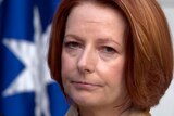 Prime Minister Julia Gillard reacts during a press conference at Parliament House in Canberra