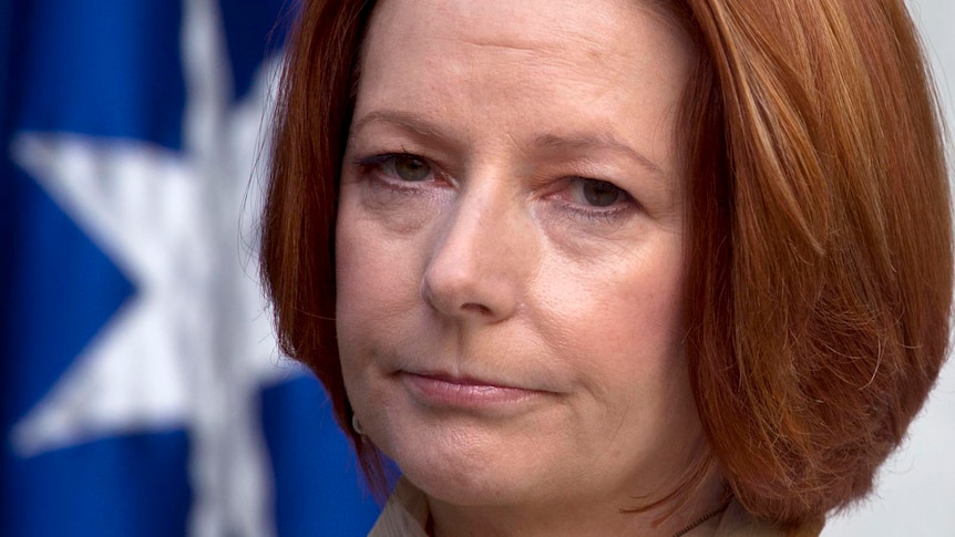 Prime Minister Julia Gillard reacts during a press conference at Parliament House in Canberra