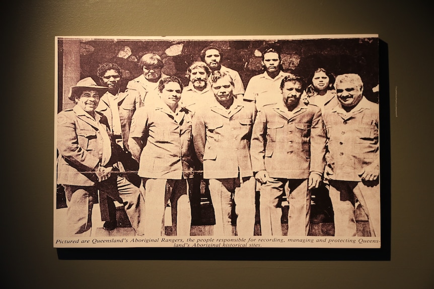 A group of men in safari suits.