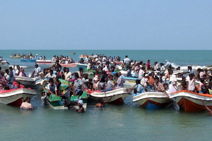Sri Lankan navy photo of what they say is thousands of people fleeing an area by boats